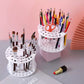 Round white lattice brush stand holding brushes upright