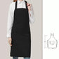 Black bib apron worn over a white shirt, with the 75 by 68 cm measurements