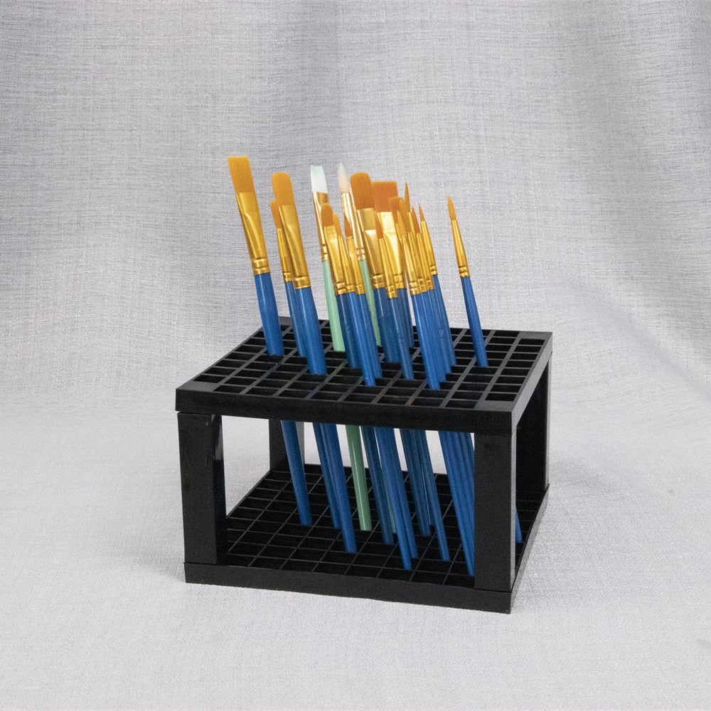 Black grid brush rack holding a set of brushes upright