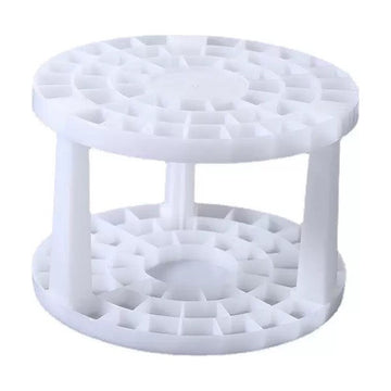 The empty round brush stand, two tiers of holes