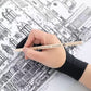 The glove resting on a drawing while the hand works