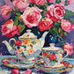 pink roses above a floral porcelain teapot and cup on a lace cloth, paint by numbers kit