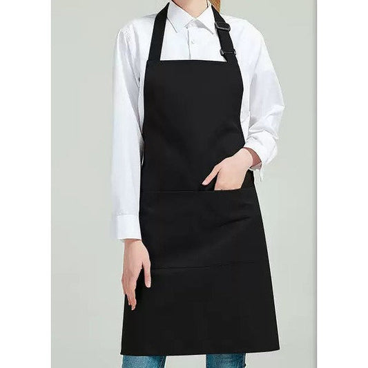 Black bib apron worn over a white shirt