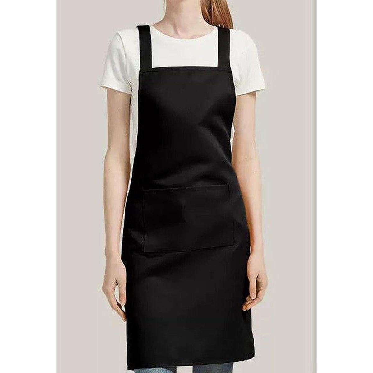 The black apron worn over a T-shirt
